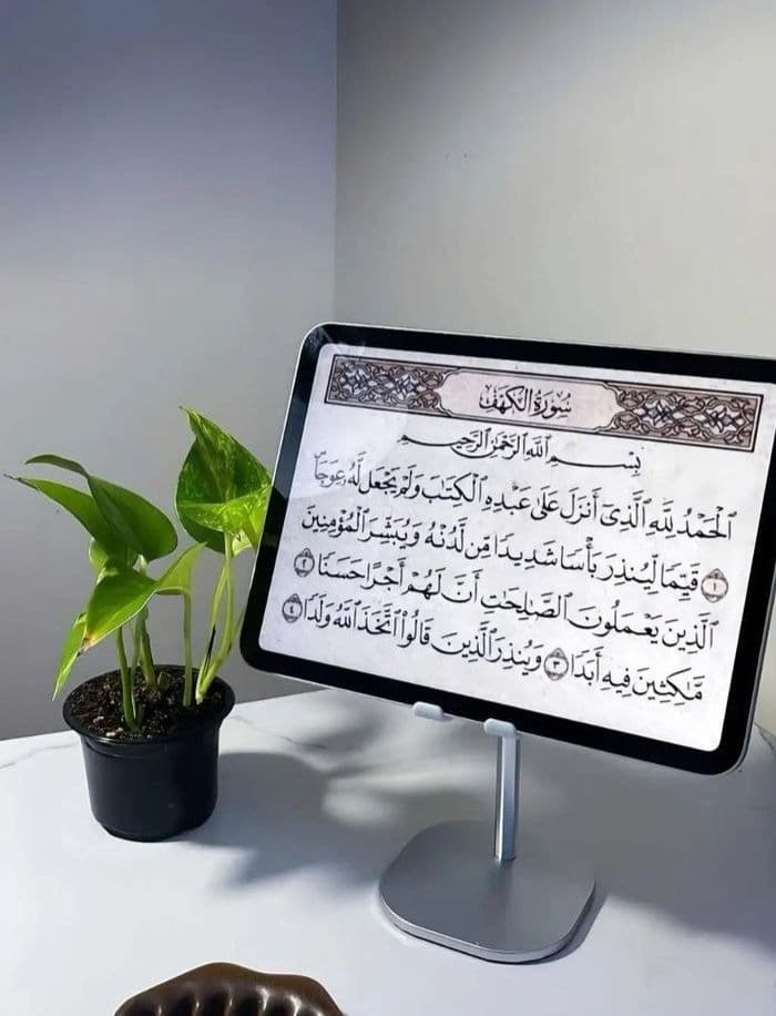 Holy Quran open on a prayer mat for a sister beginning her Quran recitation journey